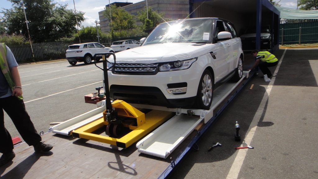 Car going into shipping container