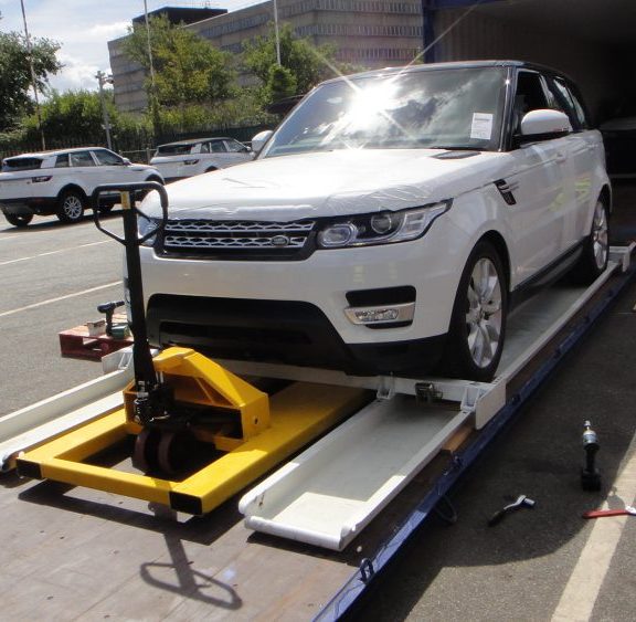 Car going into shipping container