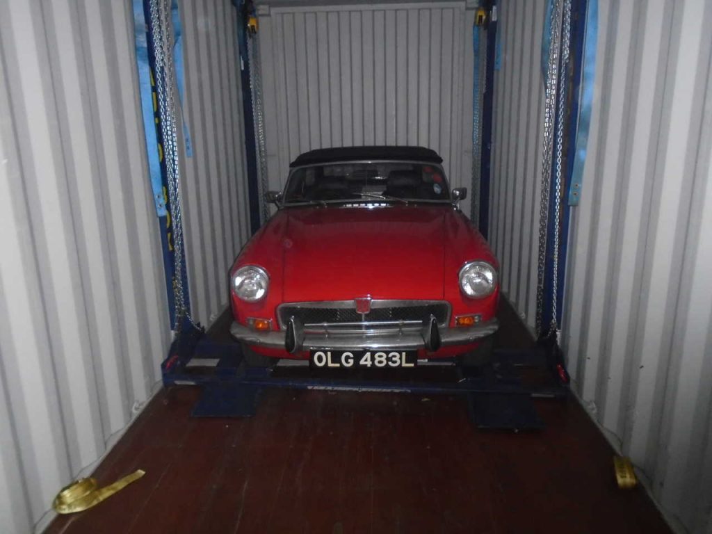 Car in shipping containers